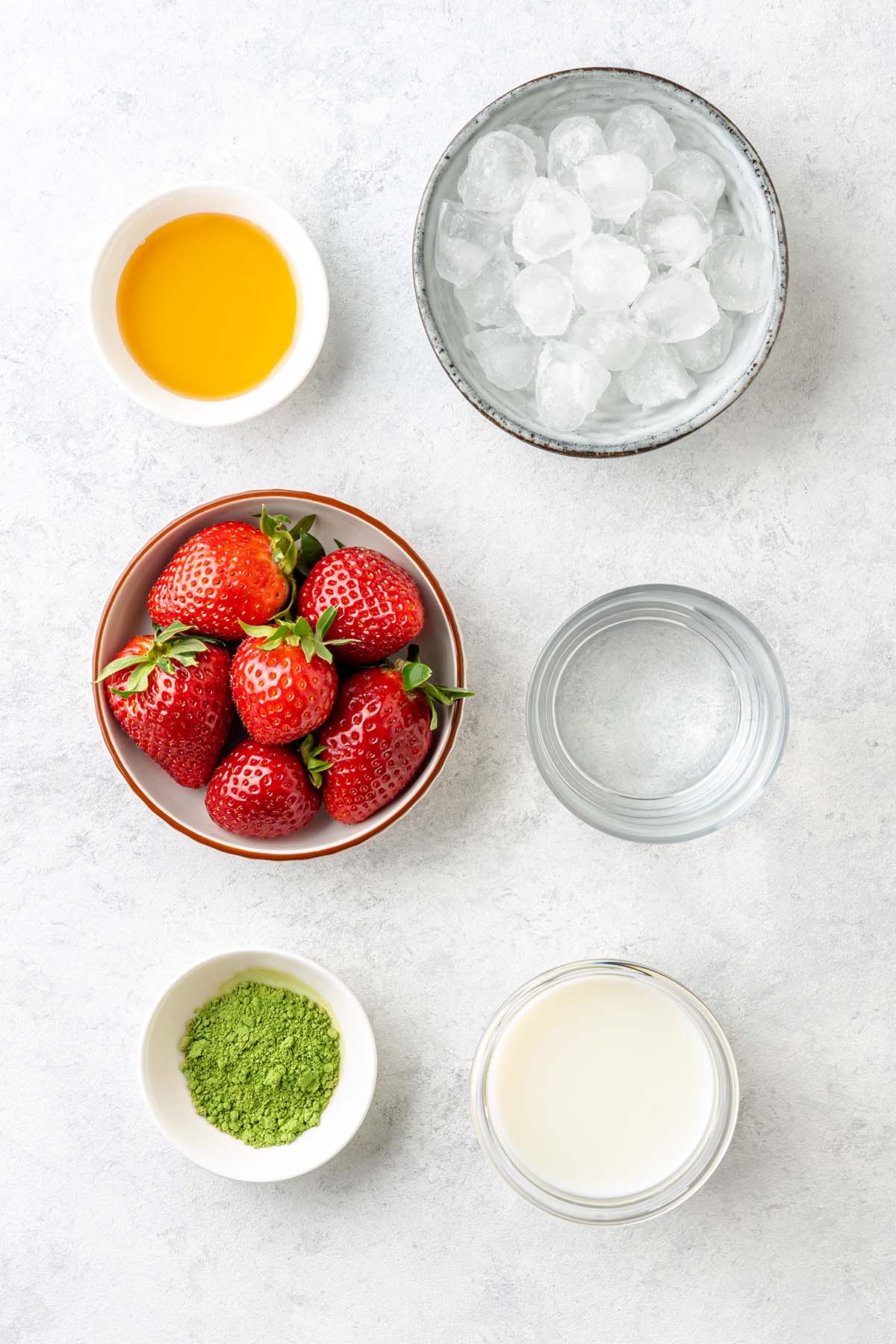 Ingredients to make strawberry matcha latte