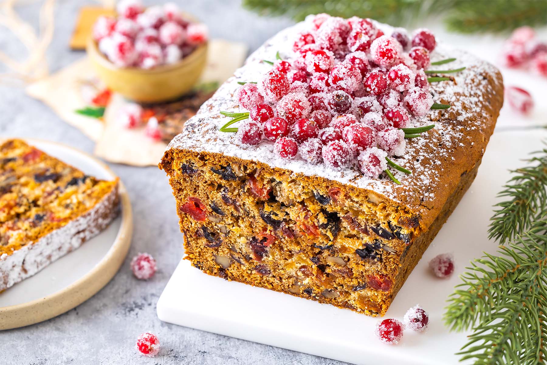 Fruit loaf cake decorated with sugared cranberries