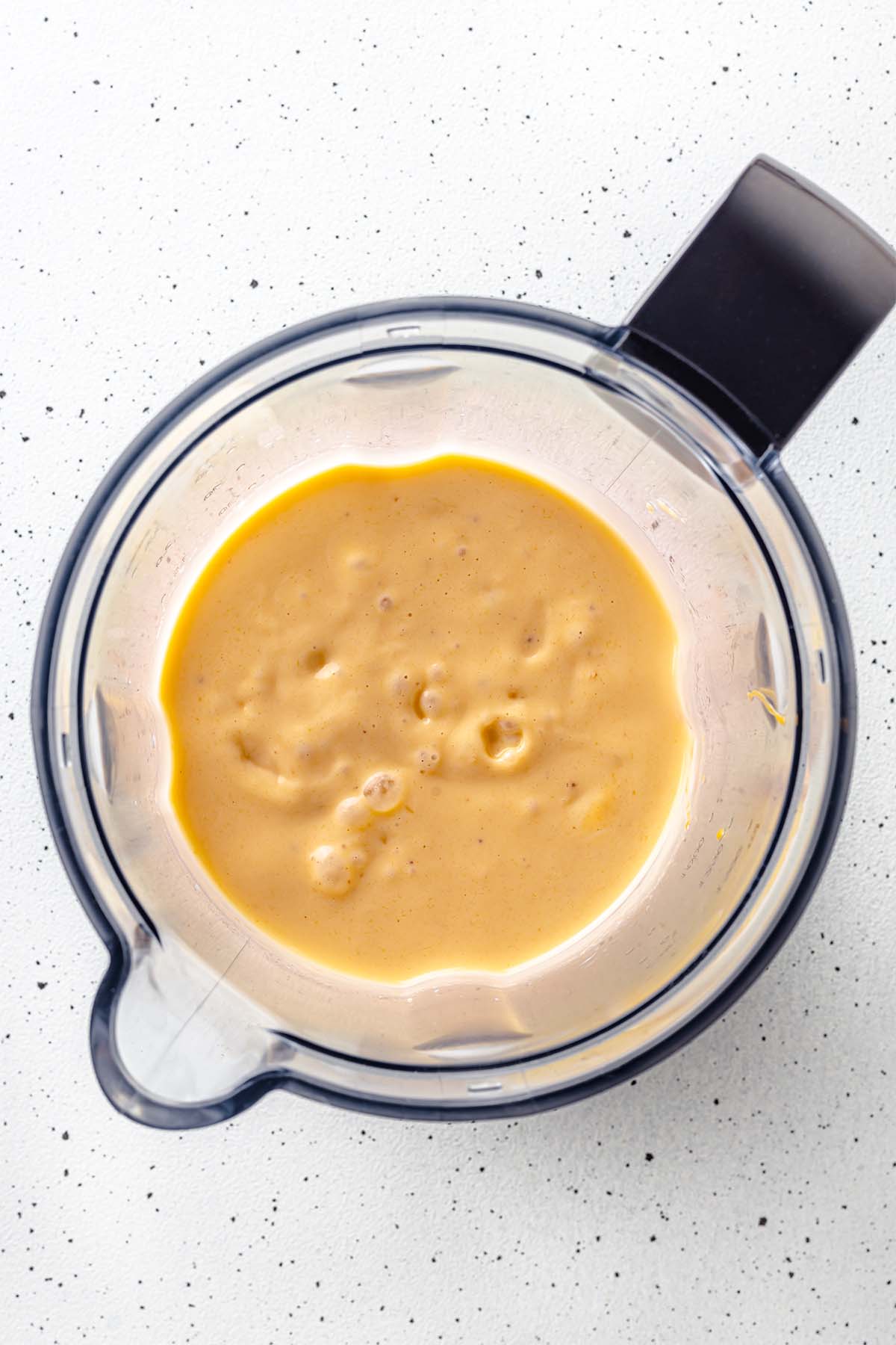Mango peanut butter smoothie in a blender