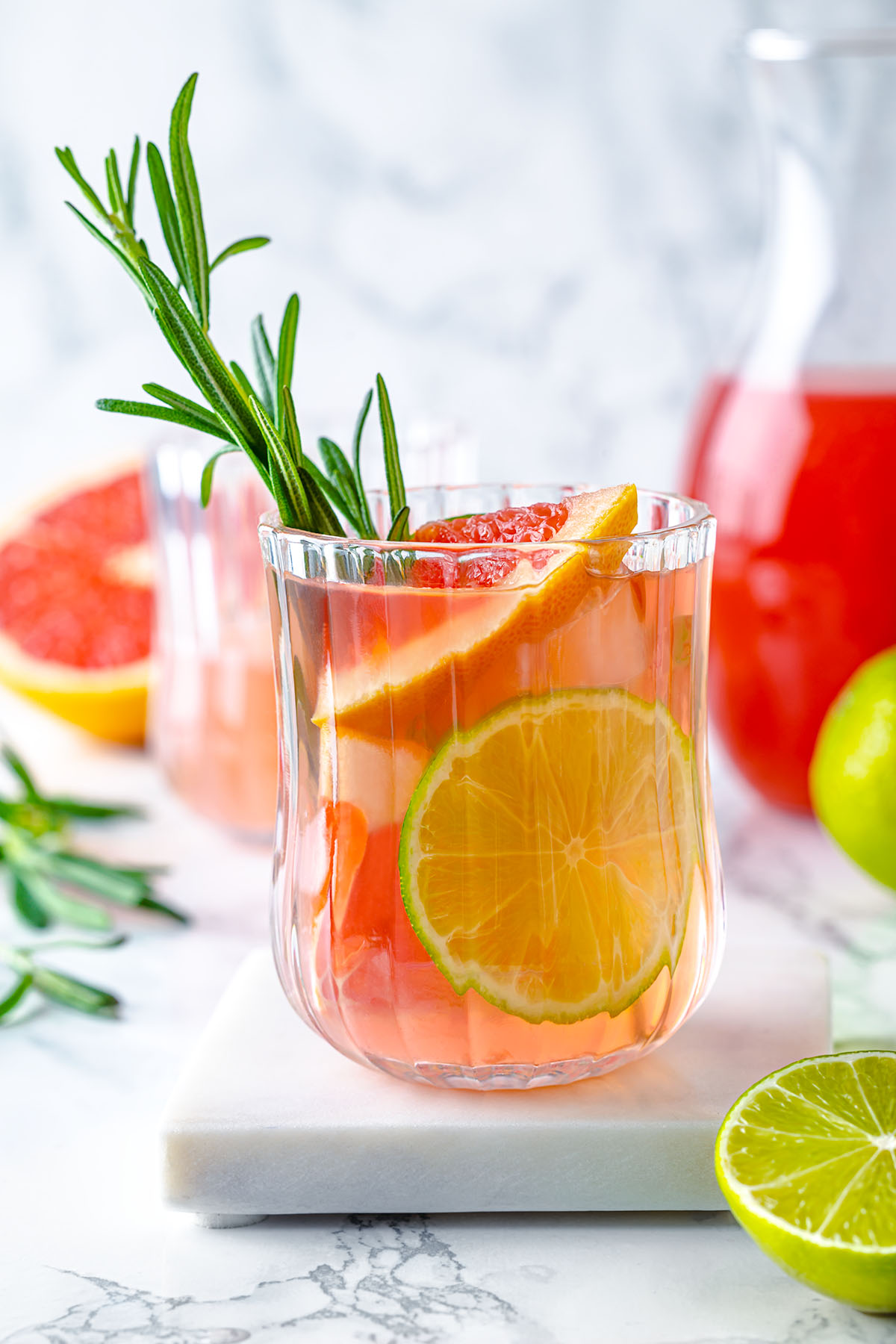 Grapefruit mocktail in a glass decorated with rosemary
