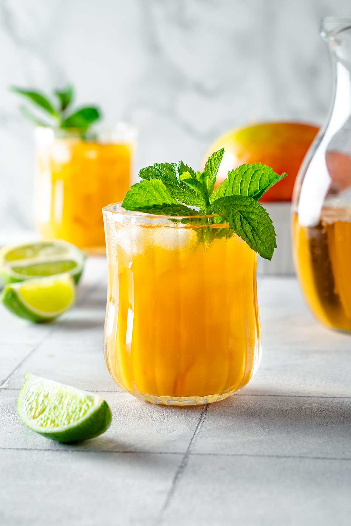 Mango mocktail in a glass decorated with fresh mint