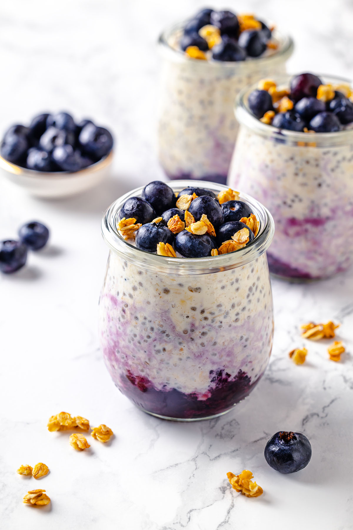 Three jars with blueberry cheesecake overnight oats