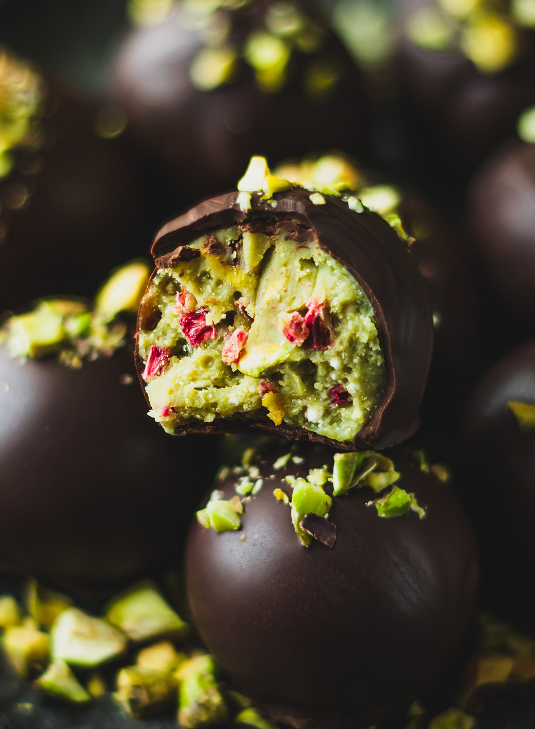 Pistachio Truffles with Raspberries, coated in dark chocolate