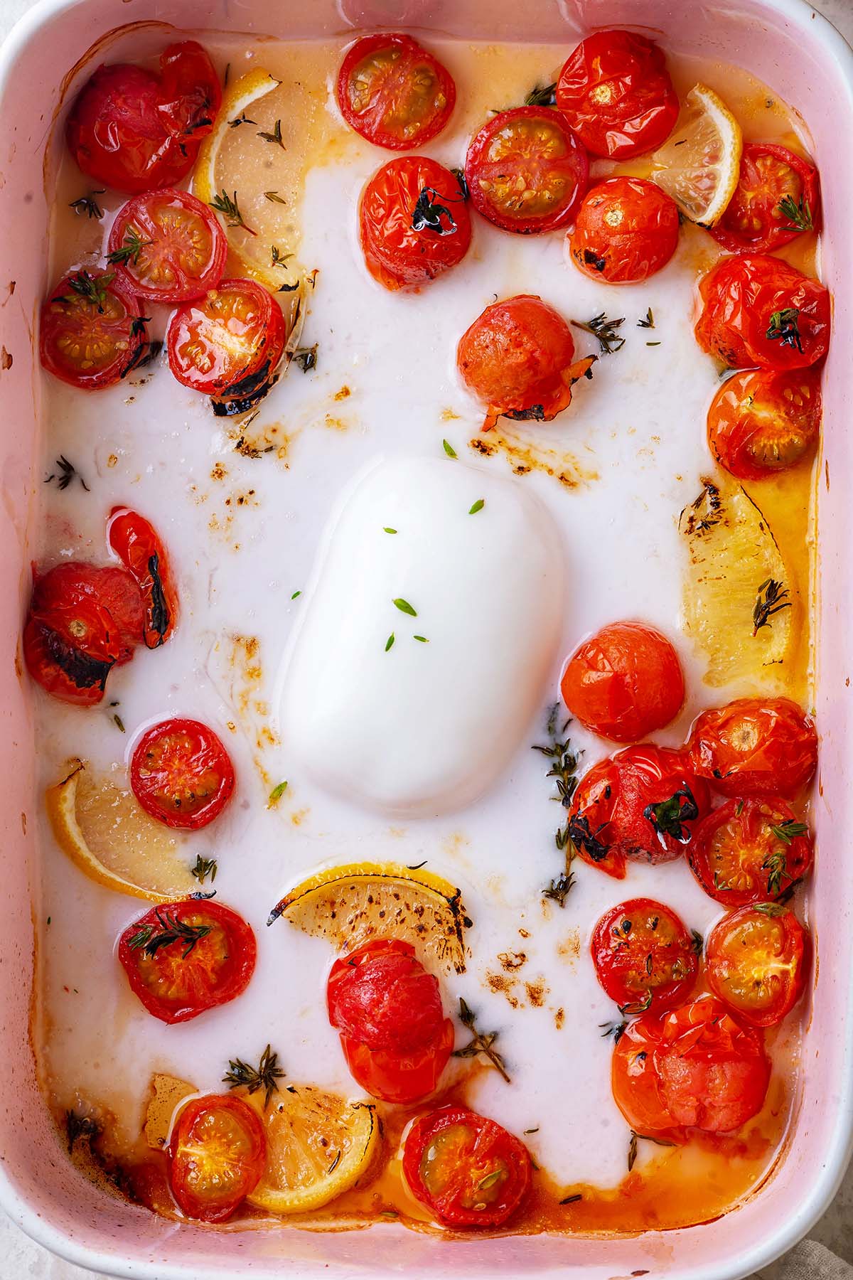 Baked melty feta and tomatoes in a baking dish