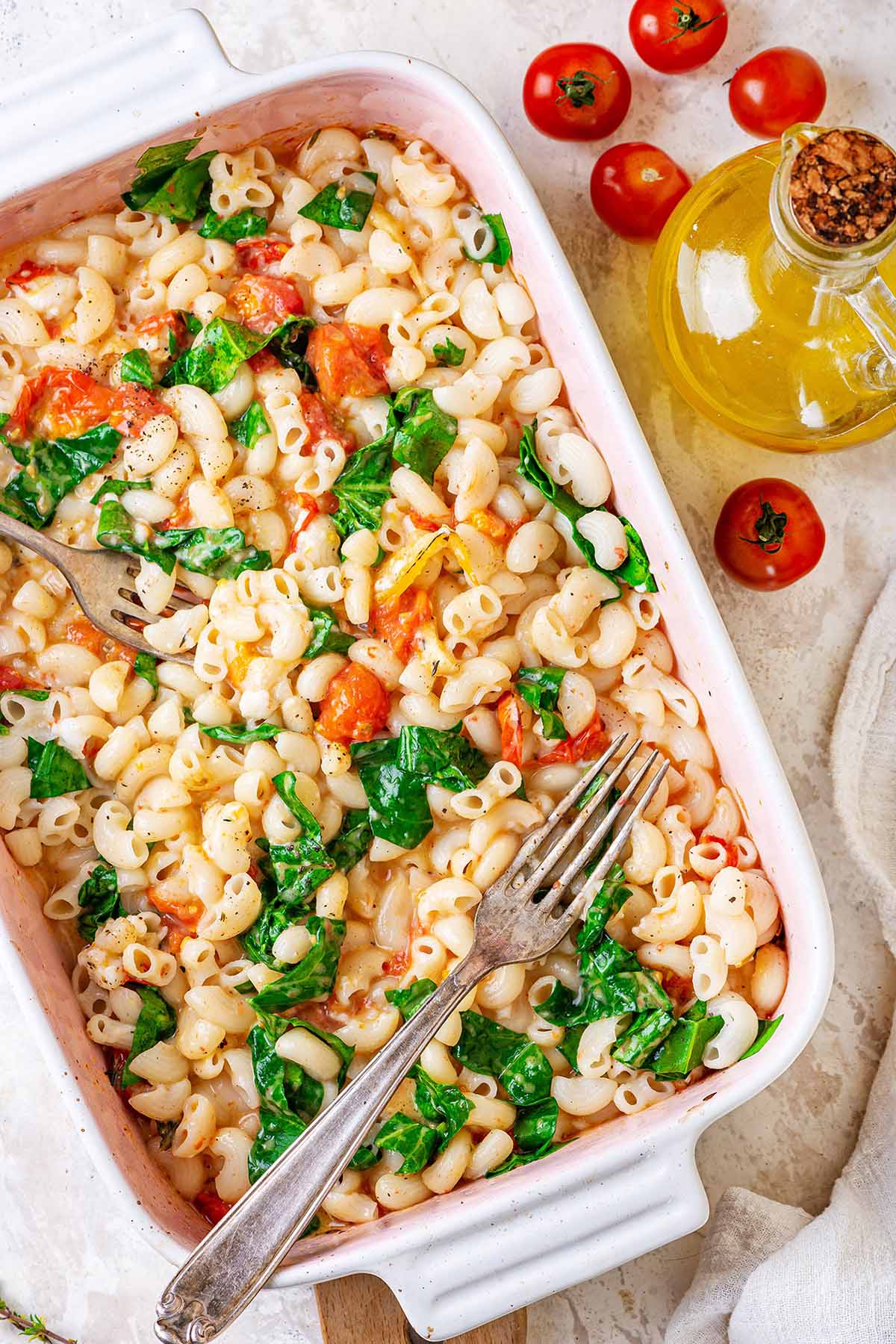 Baked feta pasta with spinach in a baking dish