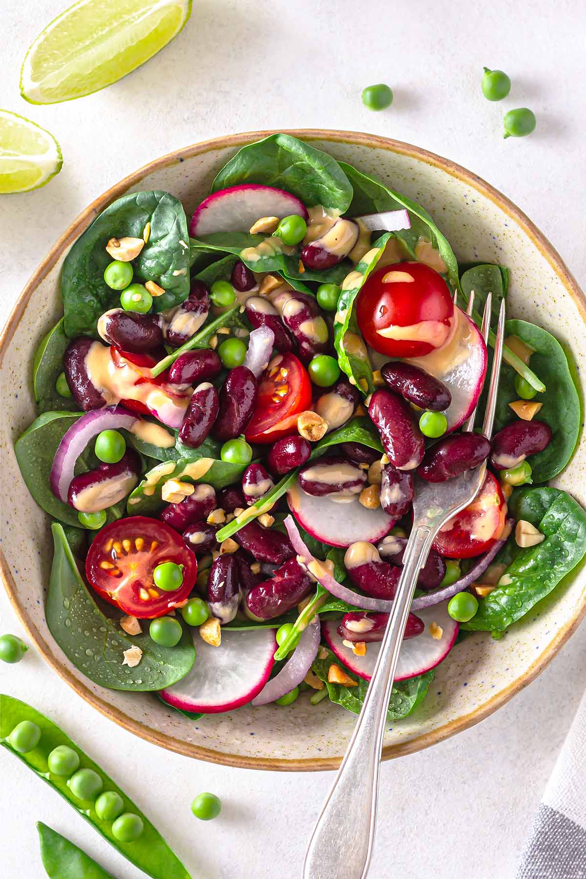 Spinach and Red Bean Salad drizzled with peanut dressing