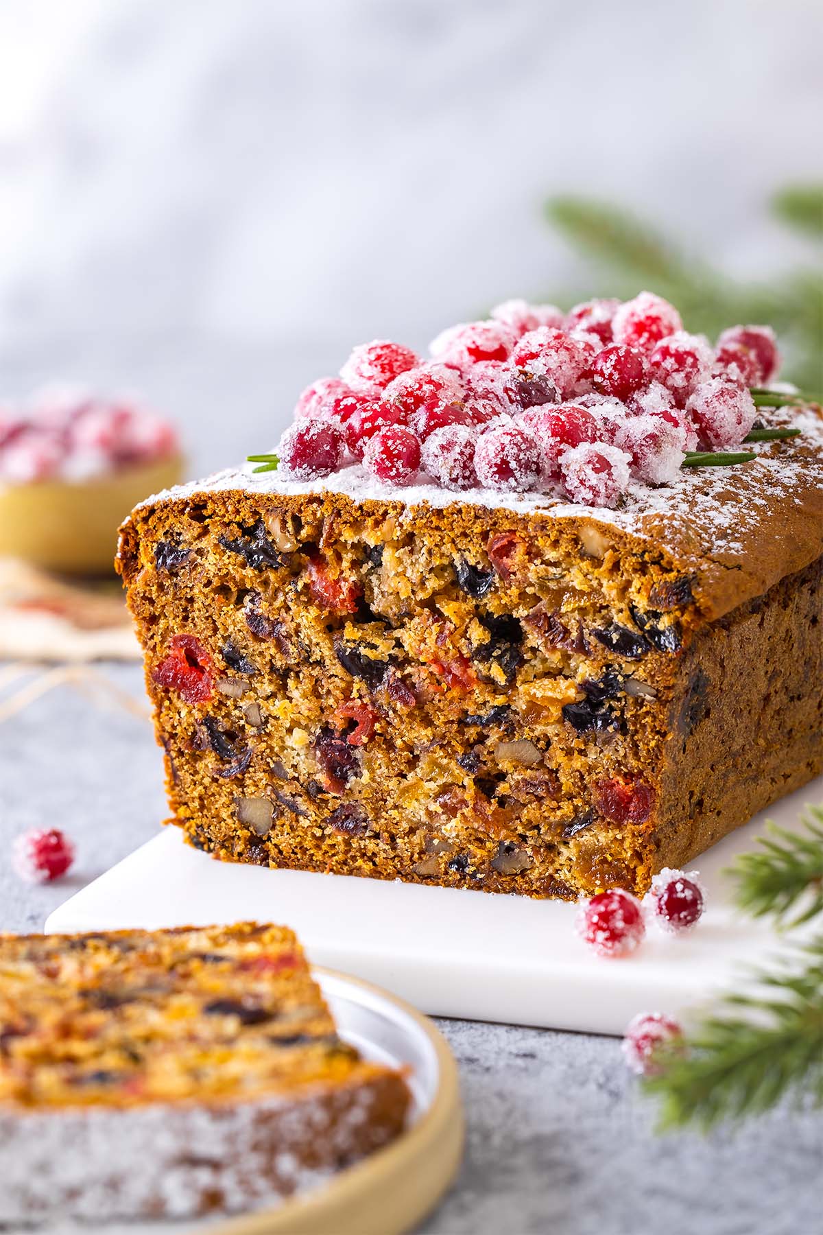Christmas loaf cake decorated with sugared cranberries