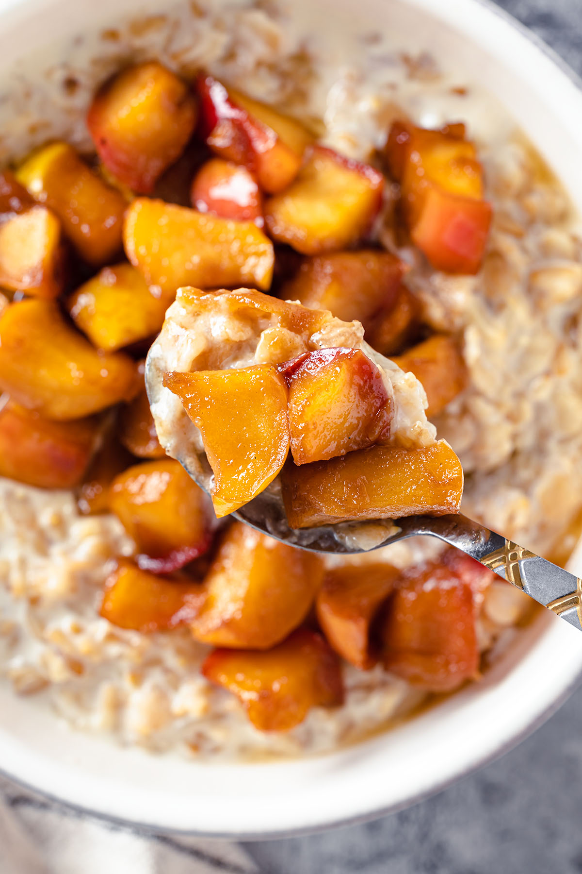 spoon with caramelized apples oatmeal