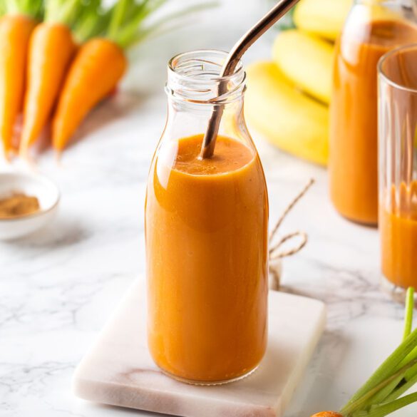 Carrot and Banana Smoothie in two glass bottles