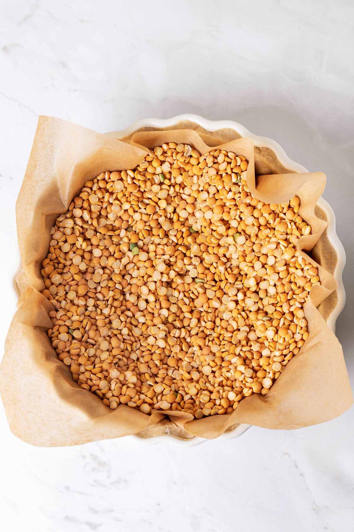 The pie crust with weights inside