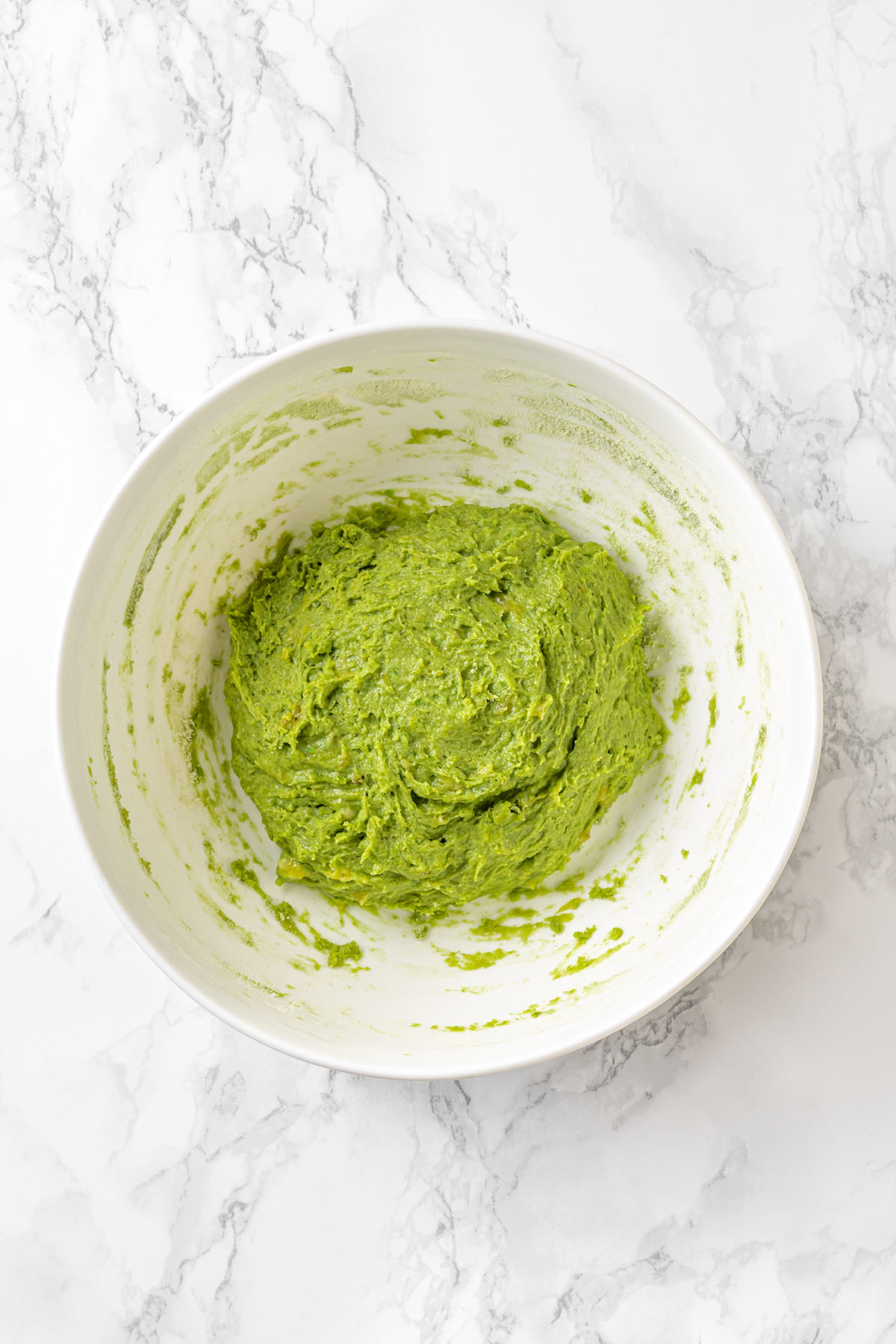 Green dough in a large bowl