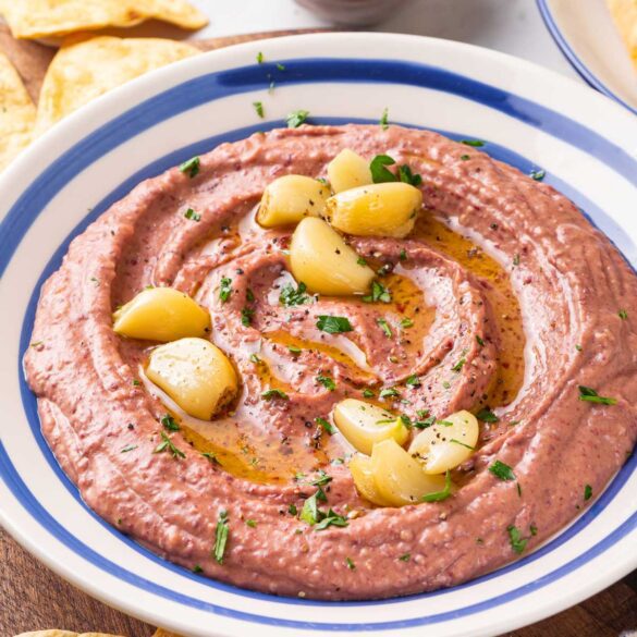 Red bean hummus with roasted garlic in a serving bowl